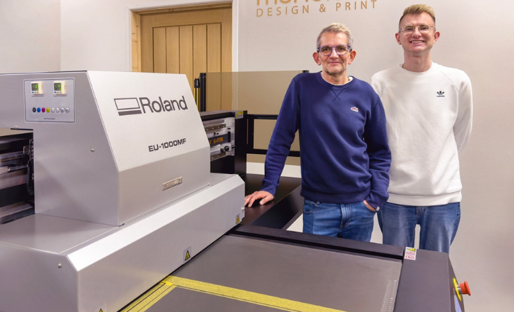 Baz Smith (L) with son Asa alongside the Roland machine