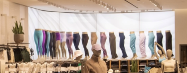 A curved lightbox in a Lululemon store in Long Island, NY
