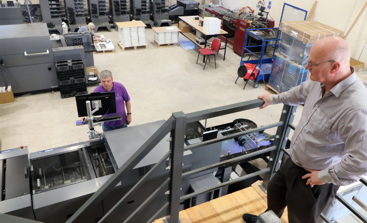 Steve Wenlock (R) looking down at the Duplo DSM-1000