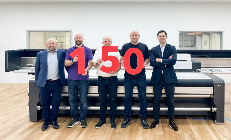 swissQprint’s Erskine Stewart (right) and Steven Pridham (left) celebrate 150 installs with Fine Print Services’ Aaron Warner, Simon Thompson and Kevin Hall.